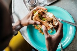 Most, but not all, plant-based burgers are considered ultra-processed, according to the Nova definition of ultra-processed food (UPF). GettyImages/Hinterhaus Productions