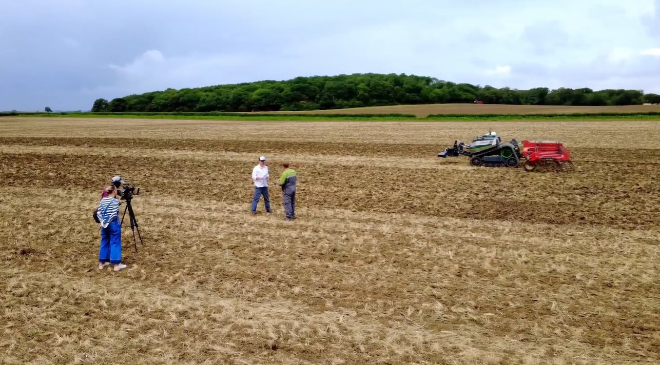 Farmers conversing in a field