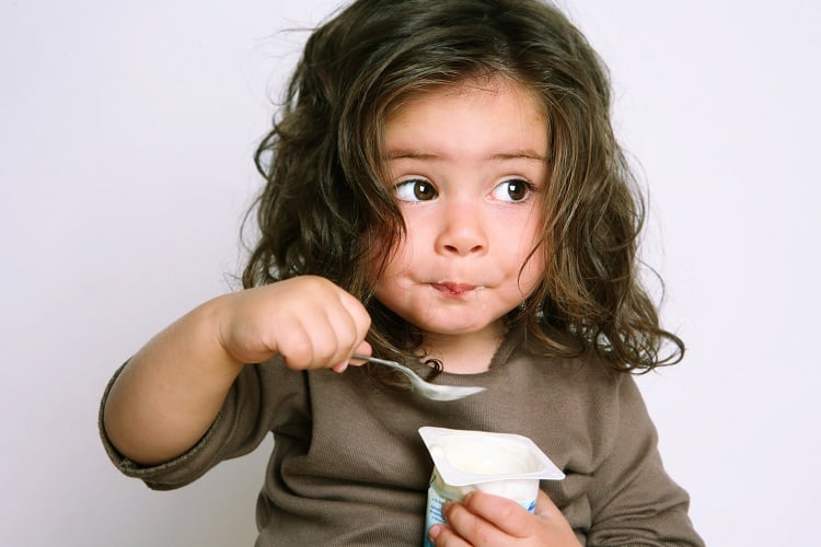 Little-girl-eating-GettyImages-Weekend-Images-Inc.jpg