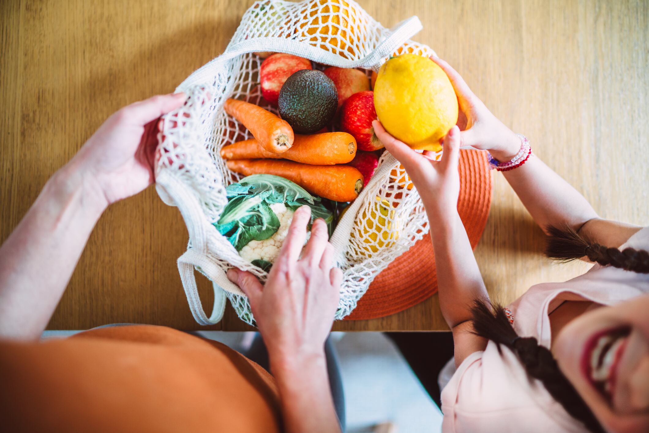 Unloading bag of produce