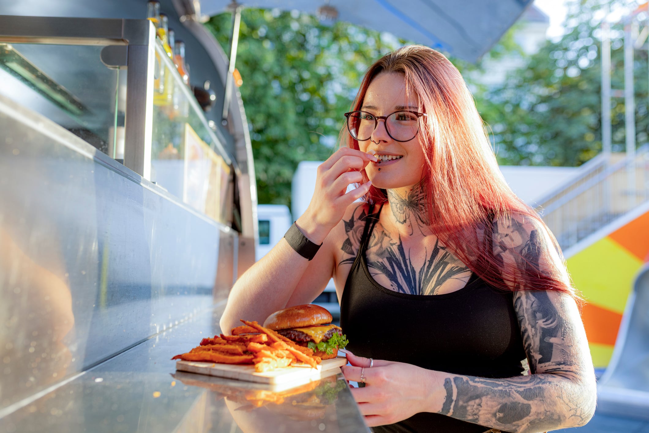 Young woman enjoying a burger