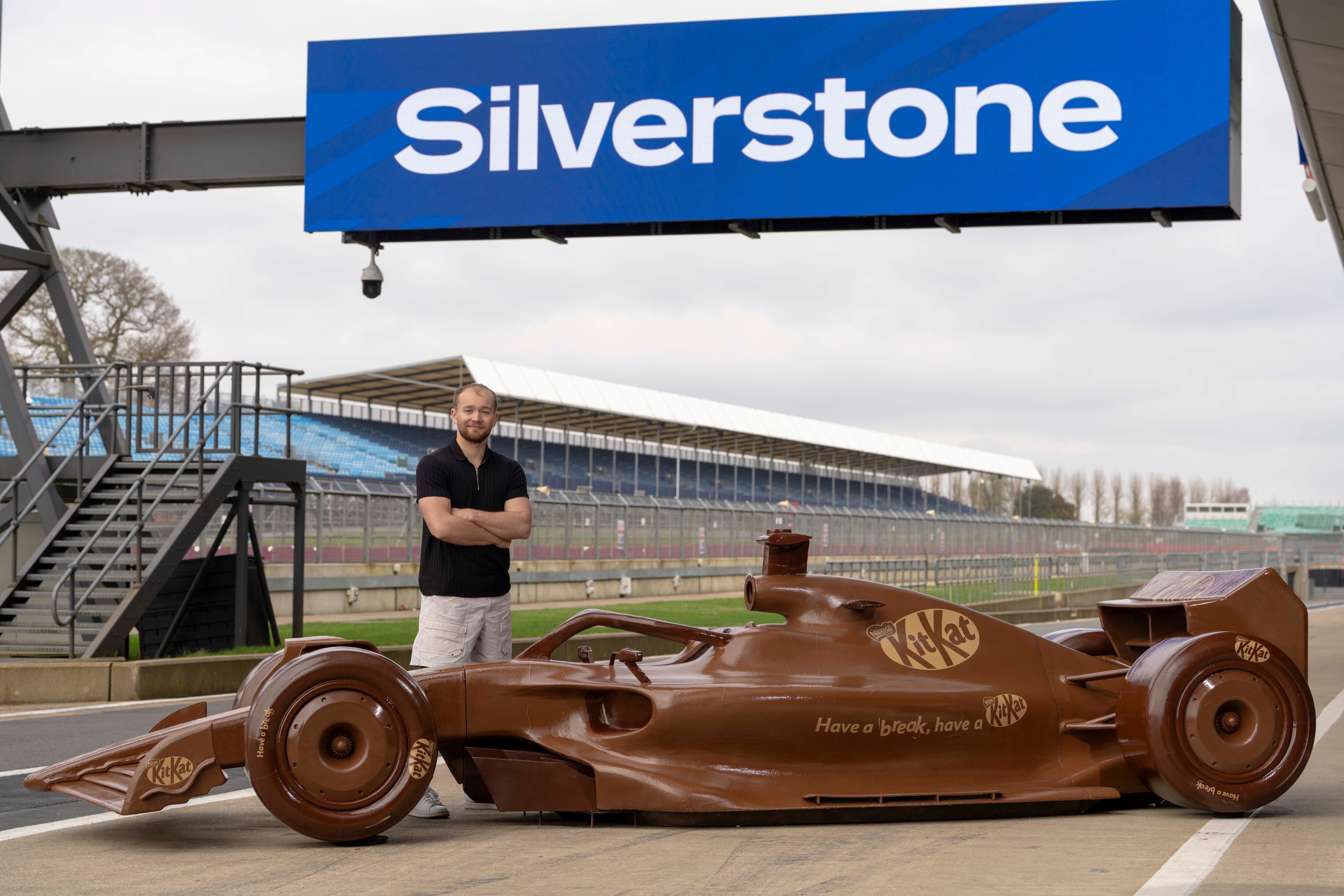 Former racing driver and commentator, Billy Monger, unveils a life-sized chocolate Formula 1 car at Silverstone Circuit to celebrate KitKat becoming the official chocolate bar of Formula 1.