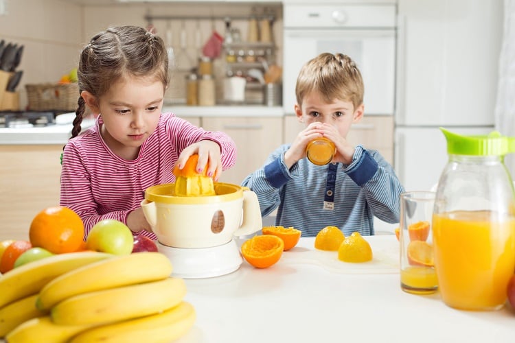 Fruit-juice-boy-and-girl-GettyImages-MelkiNimages.jpg