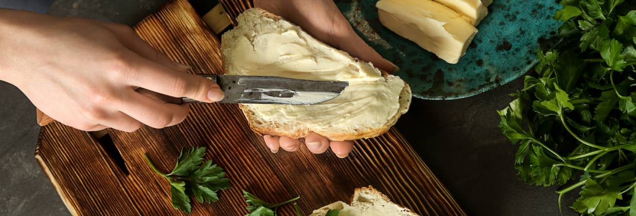 Spreading plant-based butter on bread