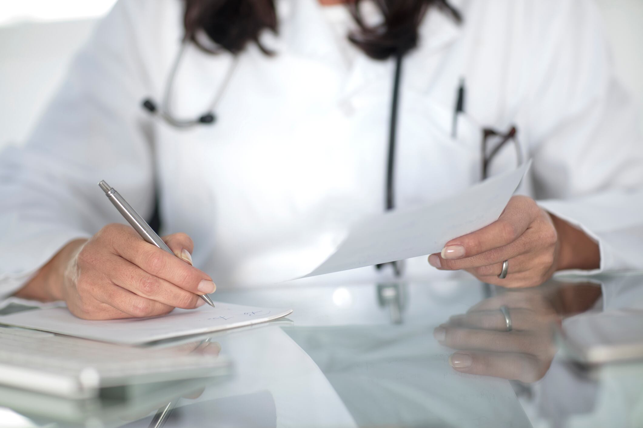 Doctor writing prescription