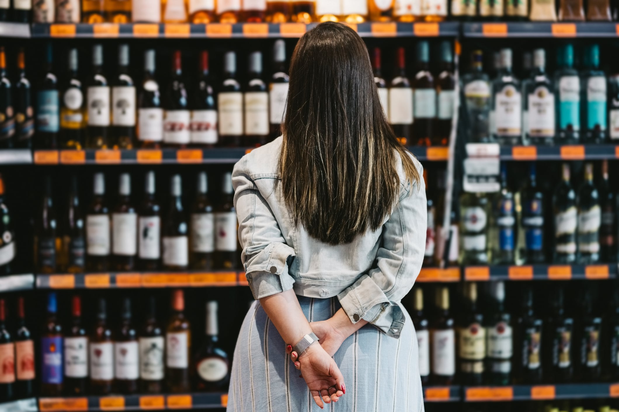 Traveller looking at duty-free alcohol