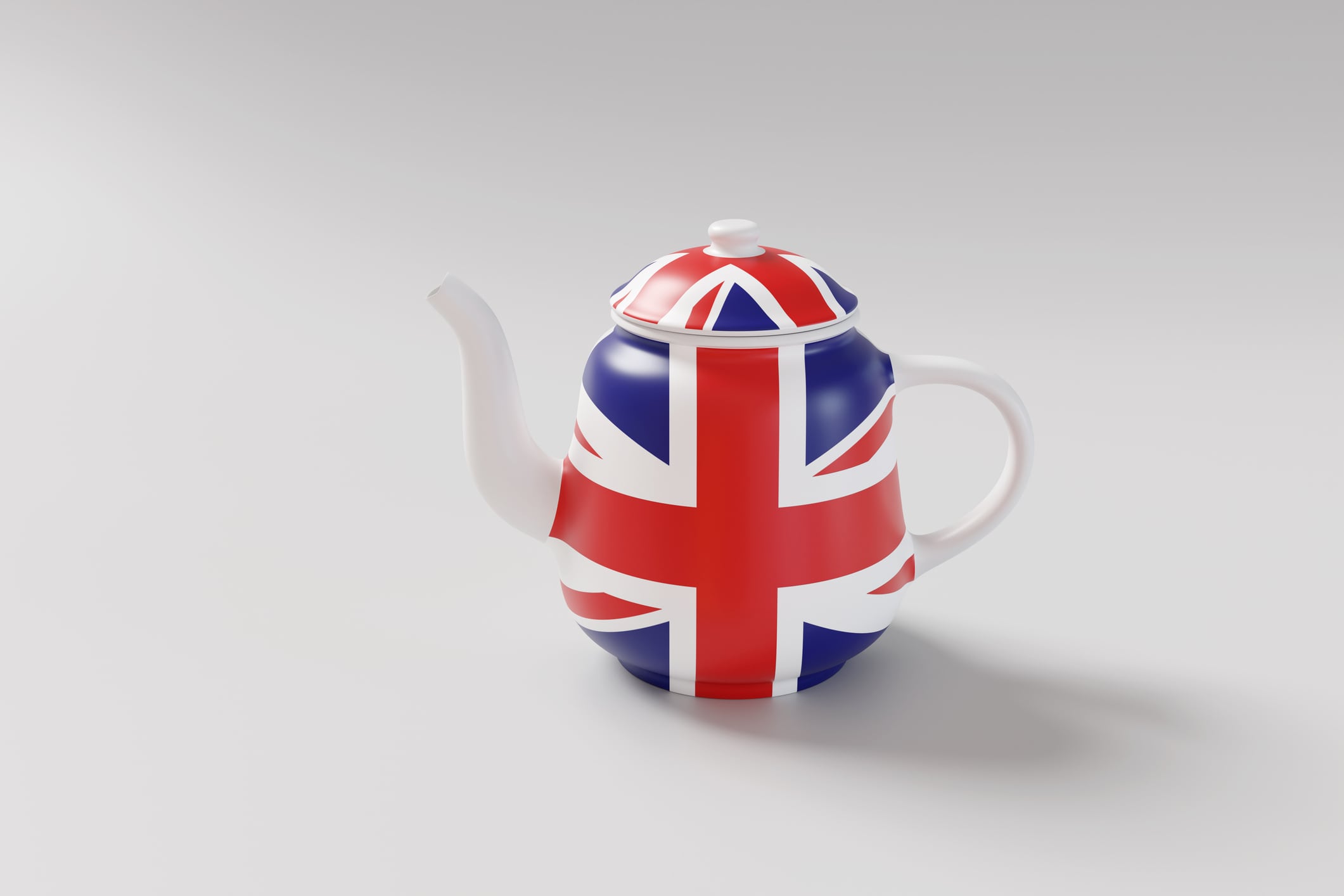 White porcelain teapot printed with the national flag of the UK (Union Jack) on white background. Illustration of the concept of British tea and cultures of United Kingdom