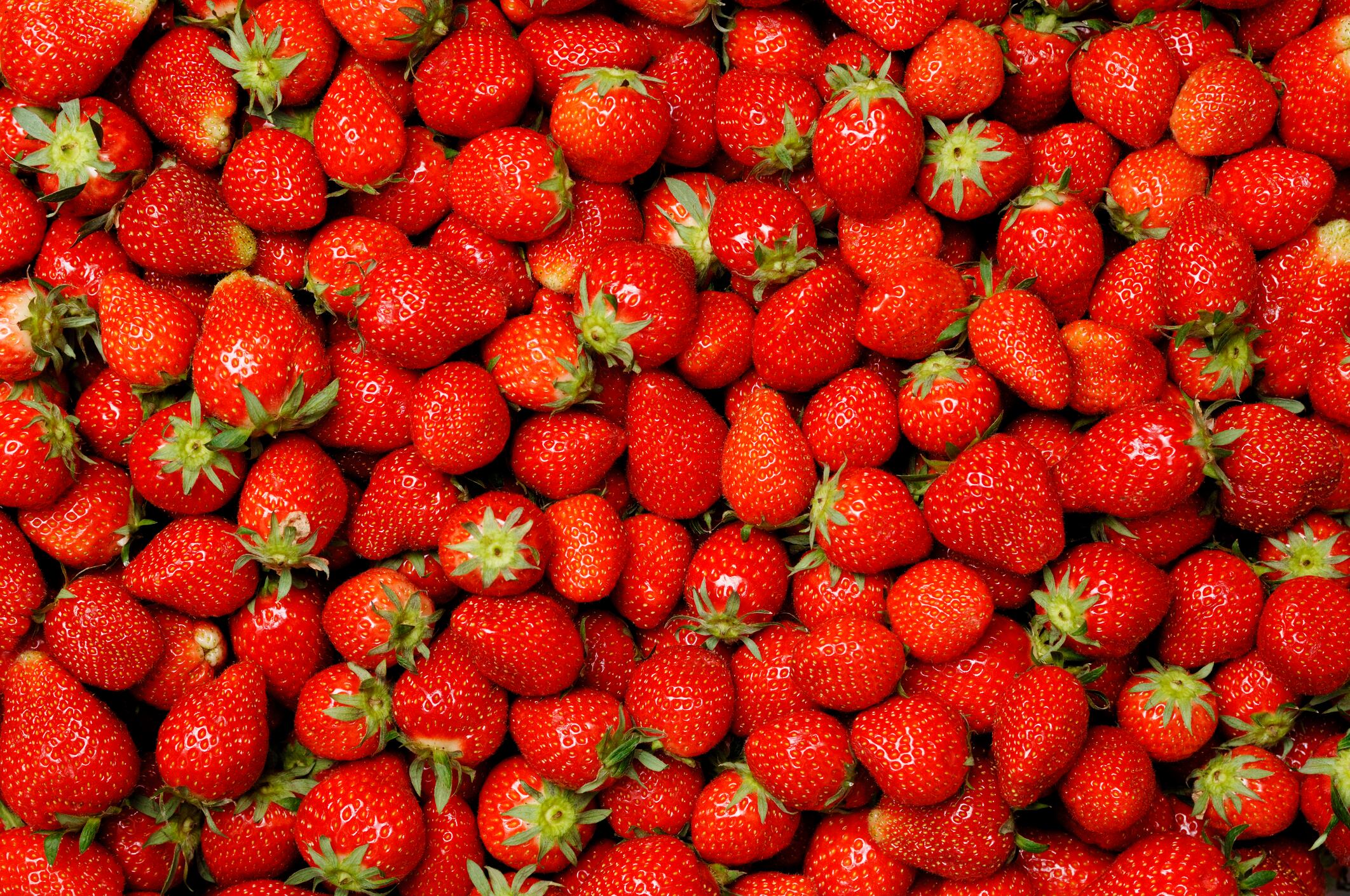 Background of hundreds of grade 'A' strawberries