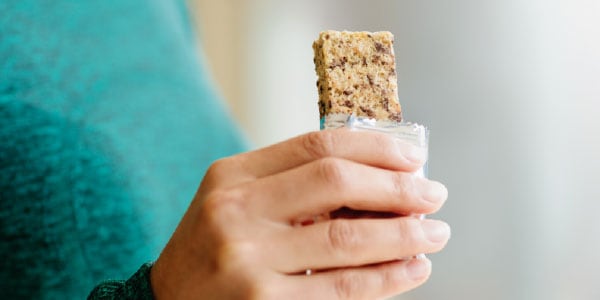 Person eating breakfast bar