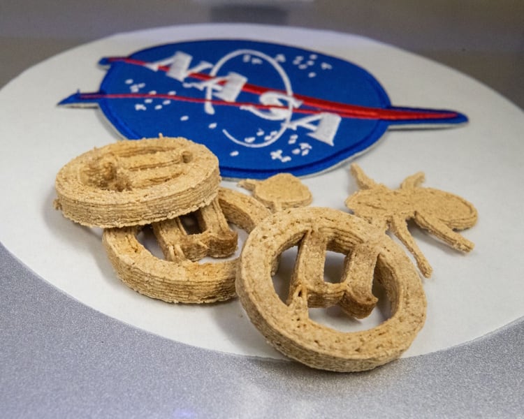 NASA-funded µBites use engineered yeast to turn plastic and agricultural waste into protein-rich, 3D-printed cookies.