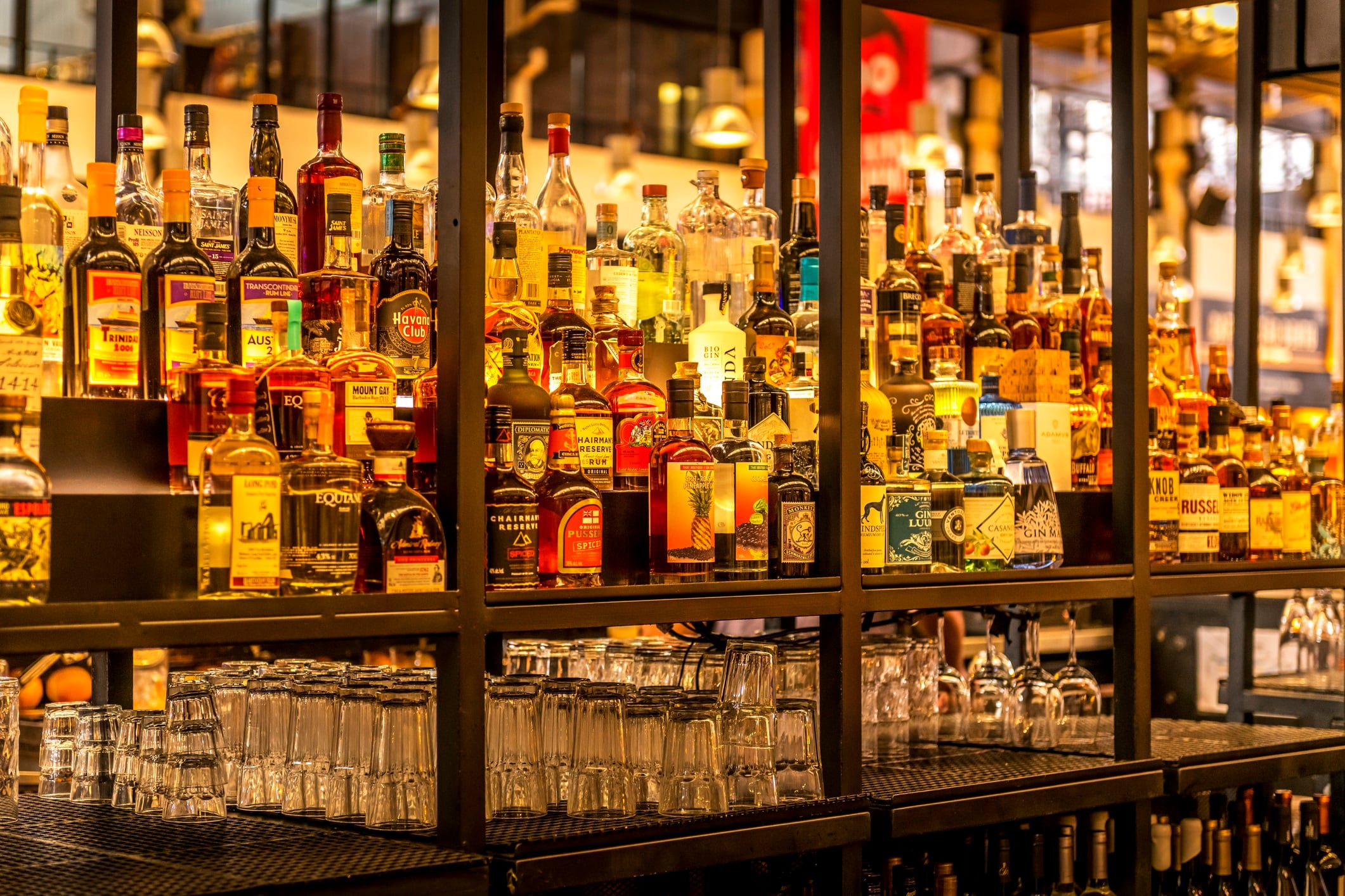 view to a lot of different alcohol bottles at a bar in Lisbon