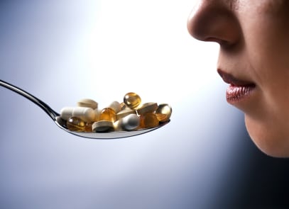 Taking-a-spoon-full-of-pills.jpg