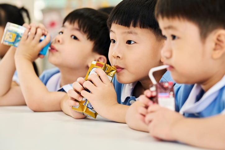 Children drinking milk in school