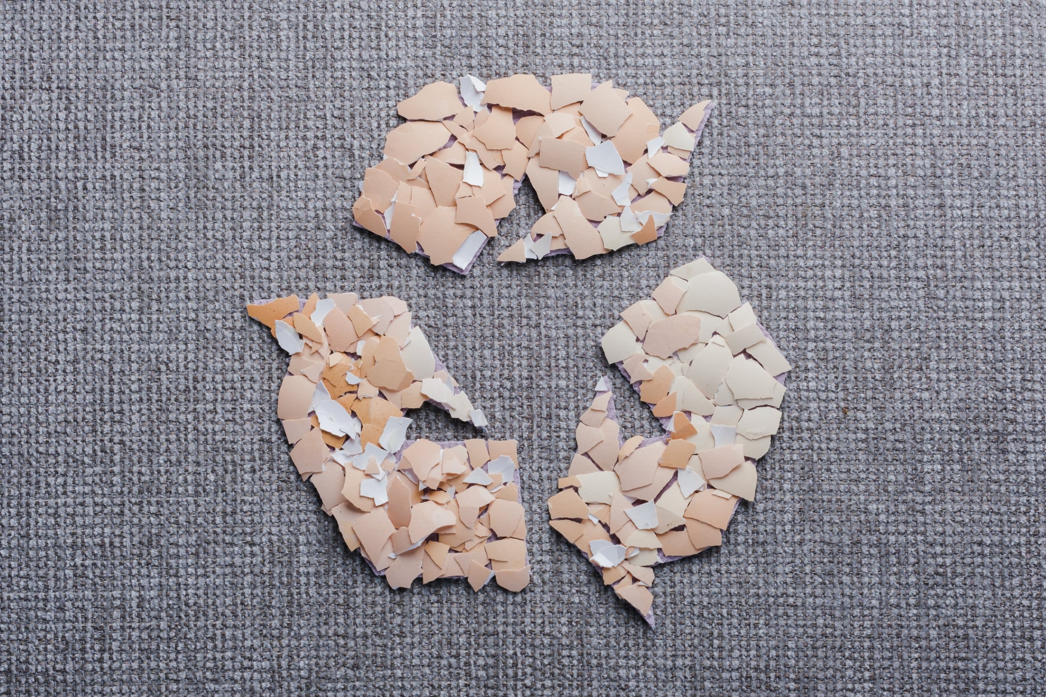 Use of eggshells in the textile industry as a sustainable material. Organic textile innovation. top view