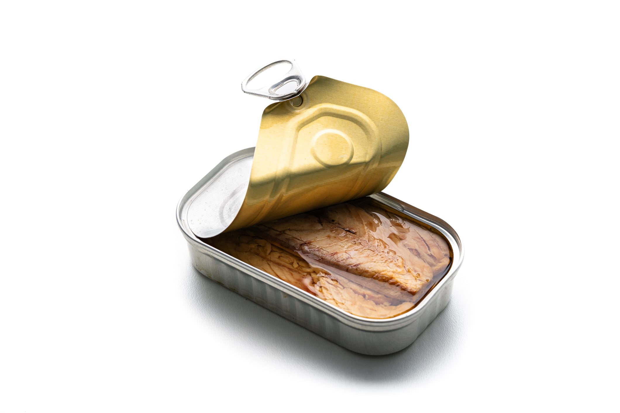 Canned mackerel isolated on white background. Open can with preserved in oil fish. Ready to eat food. Tinned tuna