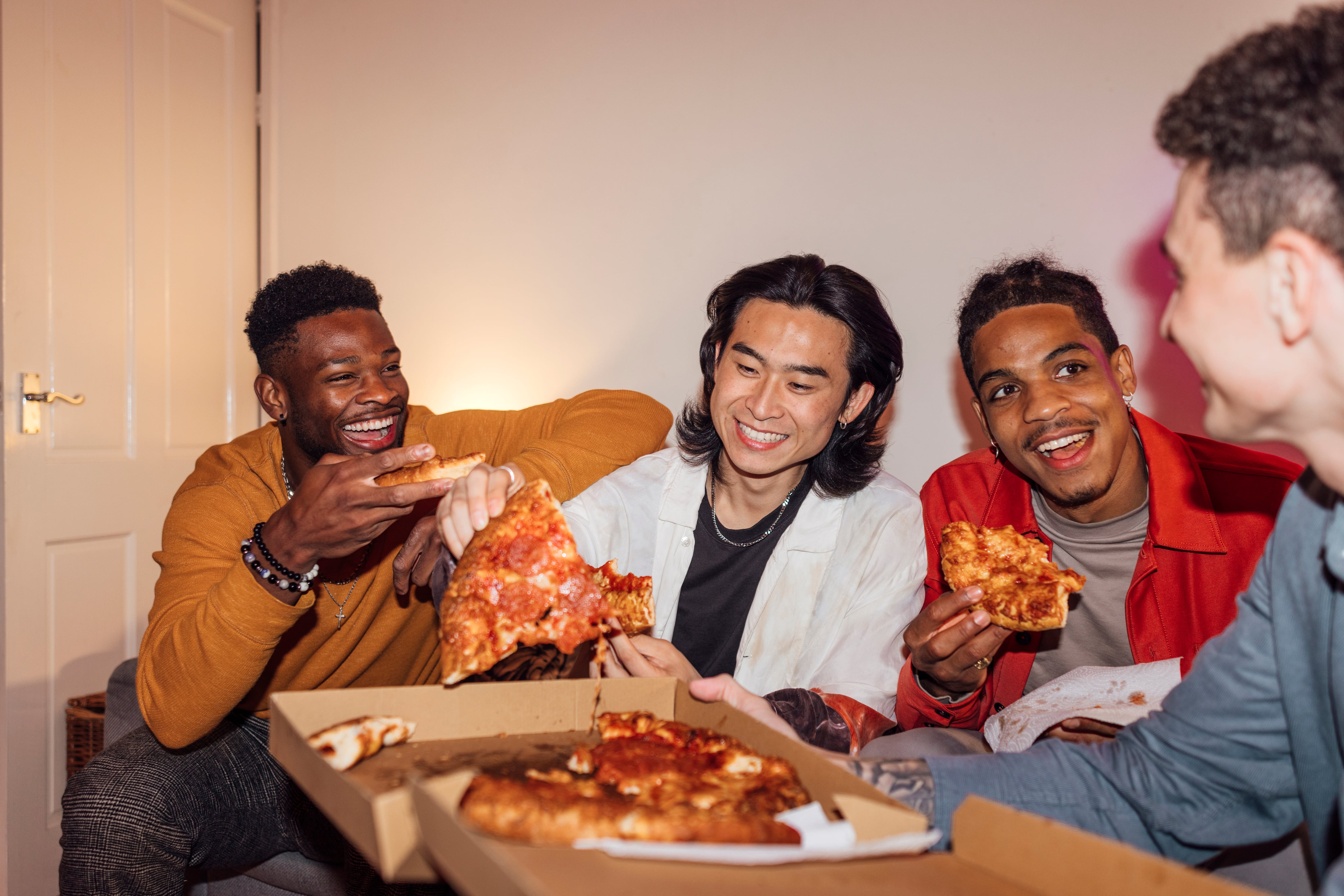 Young people eating pizza