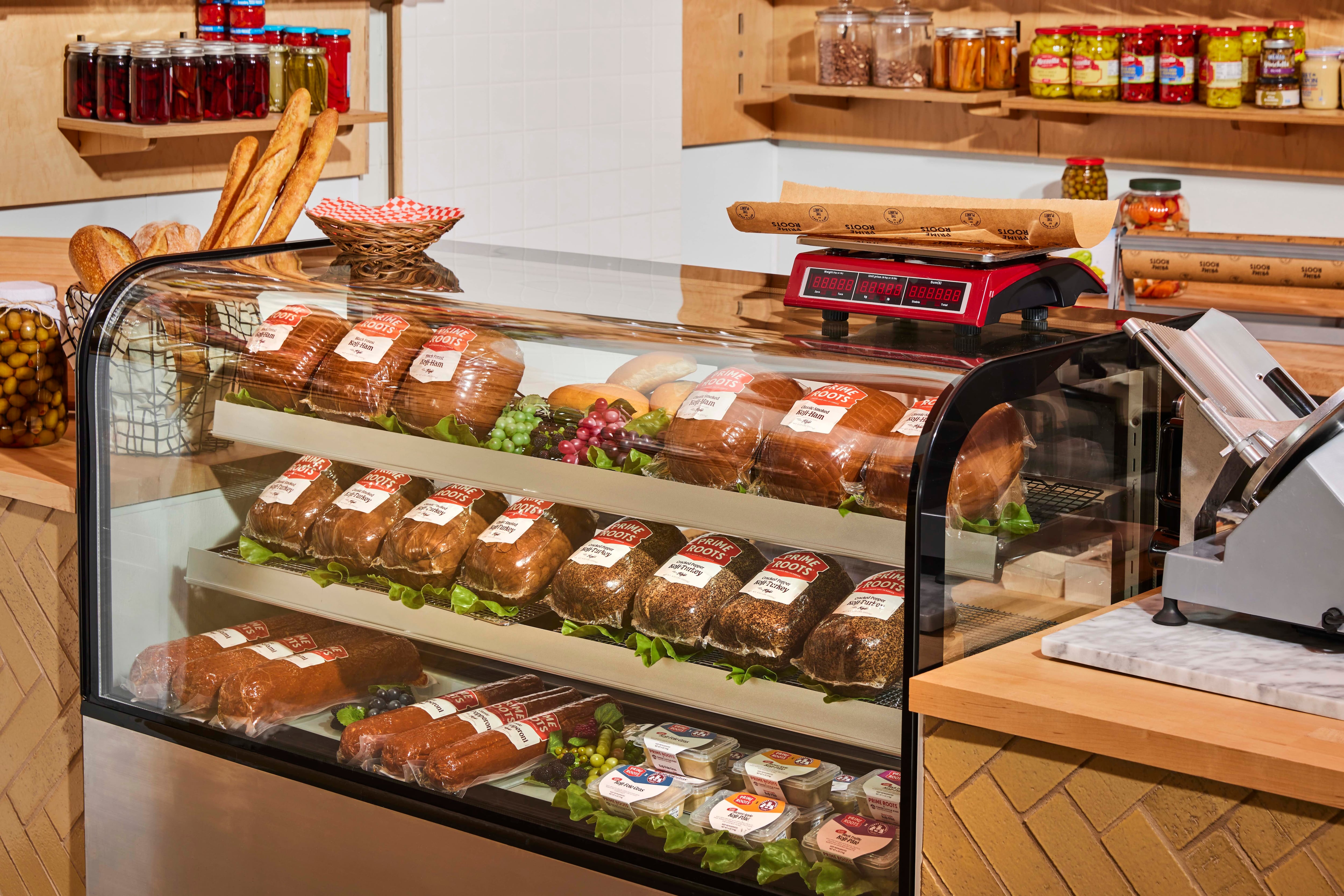 A deli case filled with Prime Roots' Koji-Meats.