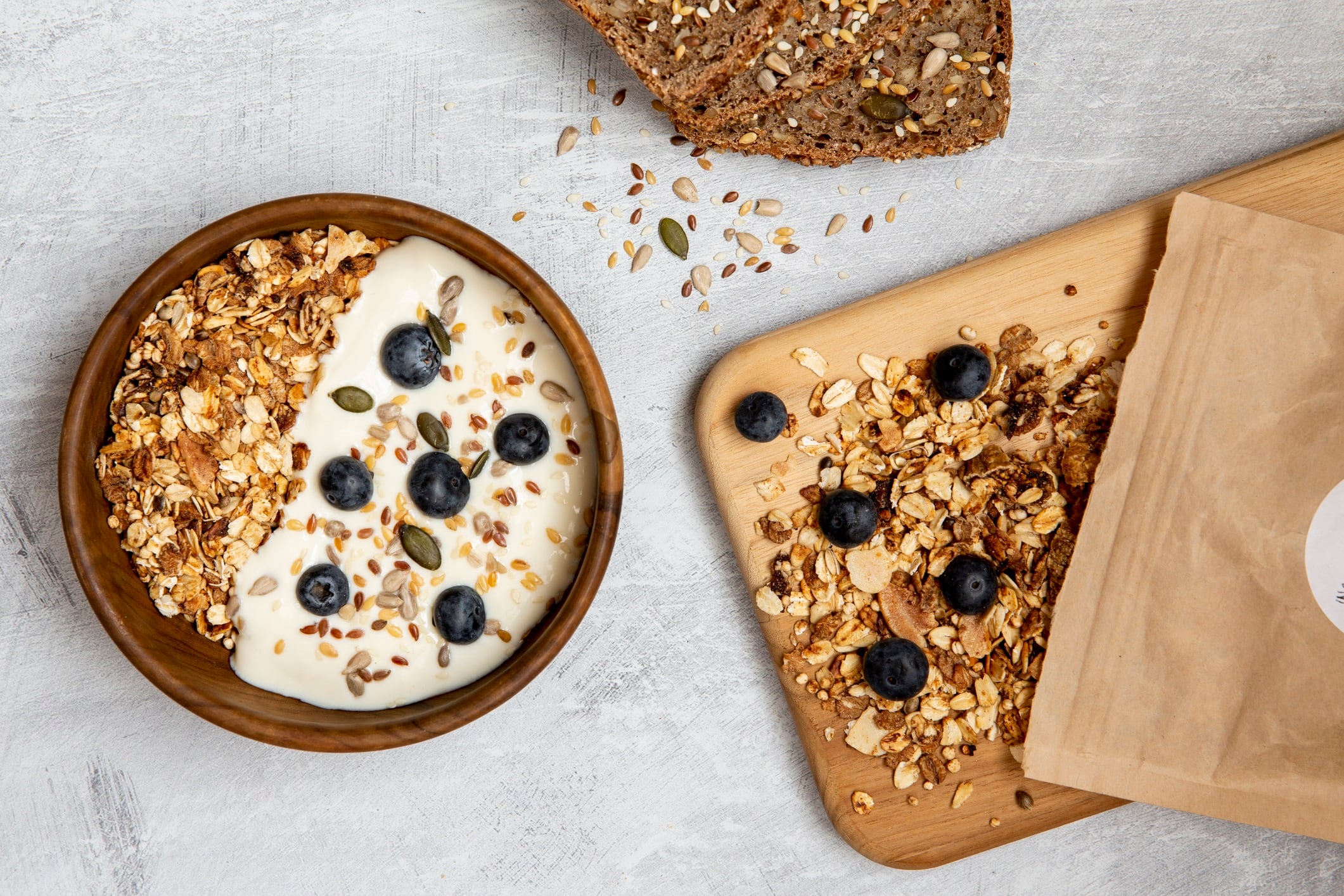 Bowl of muesli and blueberries on yogurt.