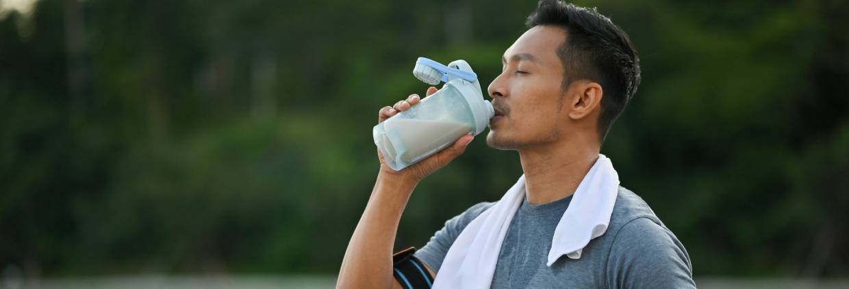 Man drinking high protein beverage