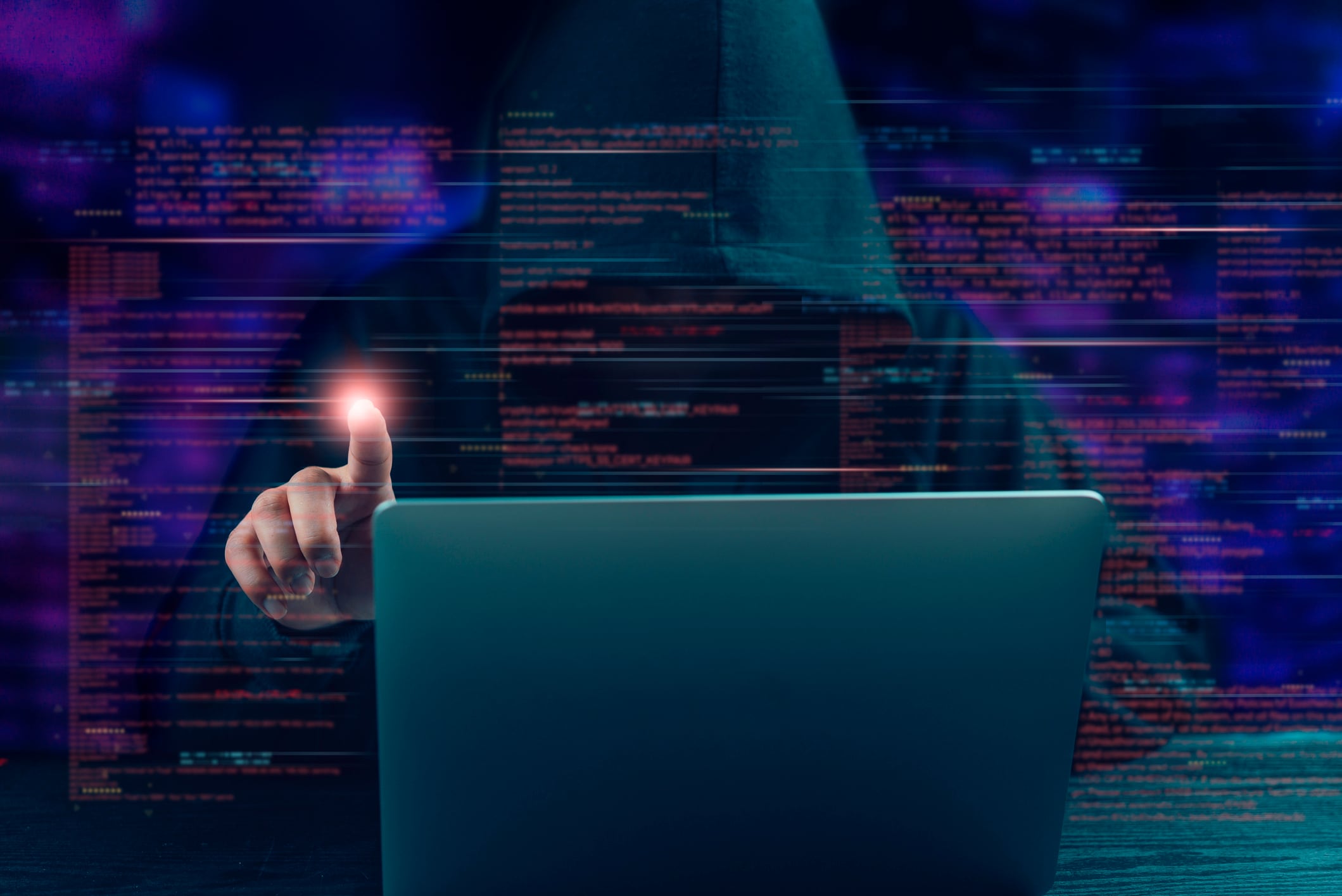 Cybercrime concept. Hacker in hoodie interacts with glowing digital interface - data breach, cyber attack, and the dark side of technology.