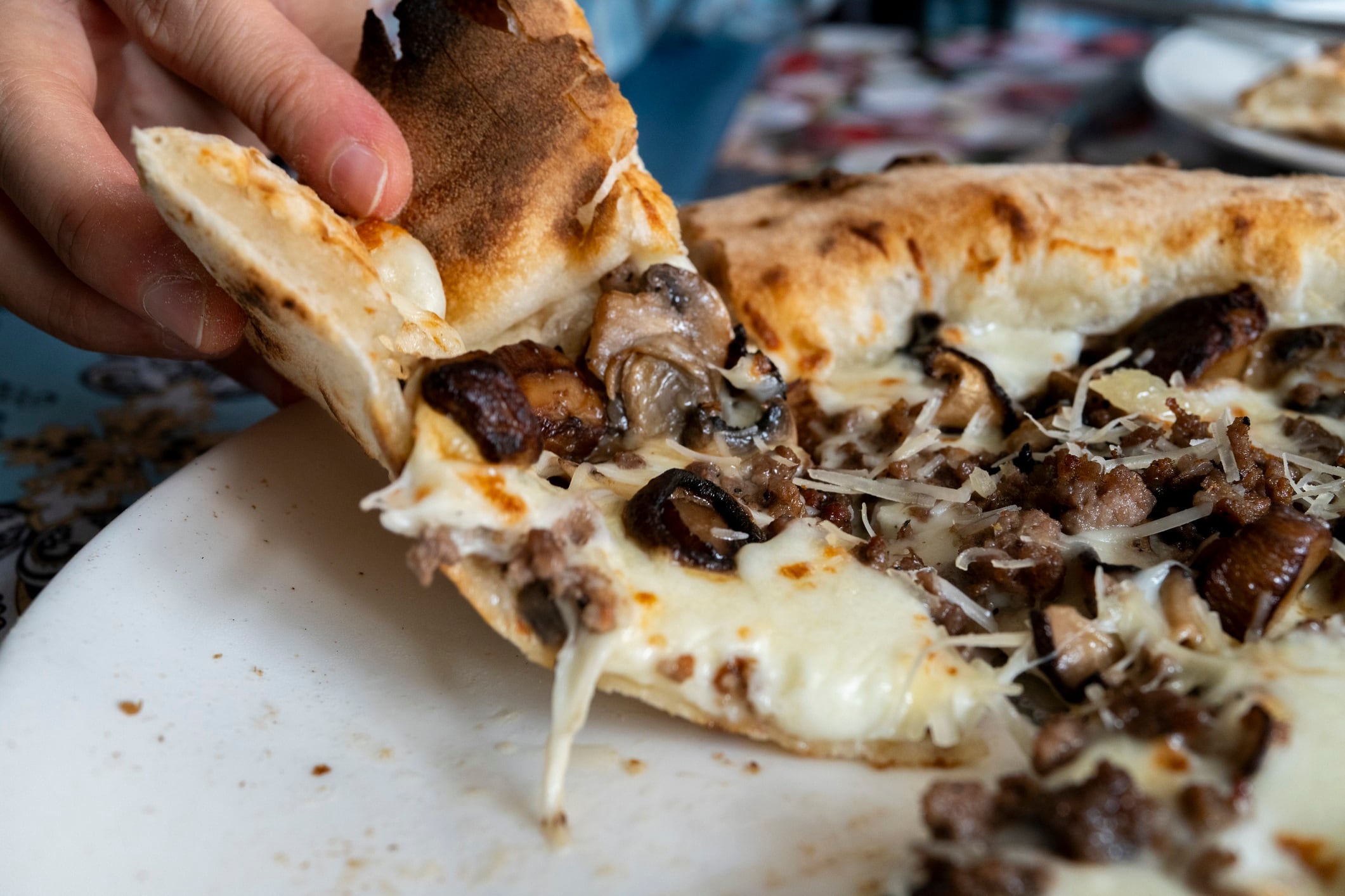eating truffle mushroom pizza