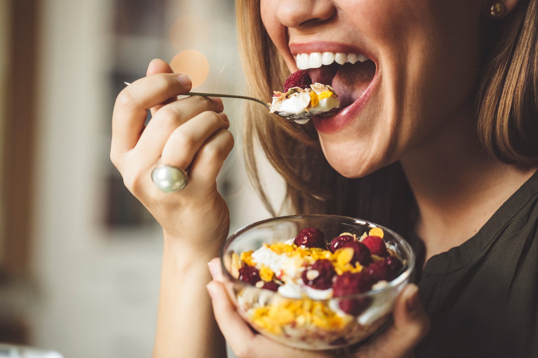 Woman eating breakfast.