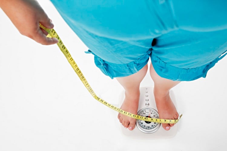Fat-person-on-scale-with-tape-measure-RapidEye.jpg