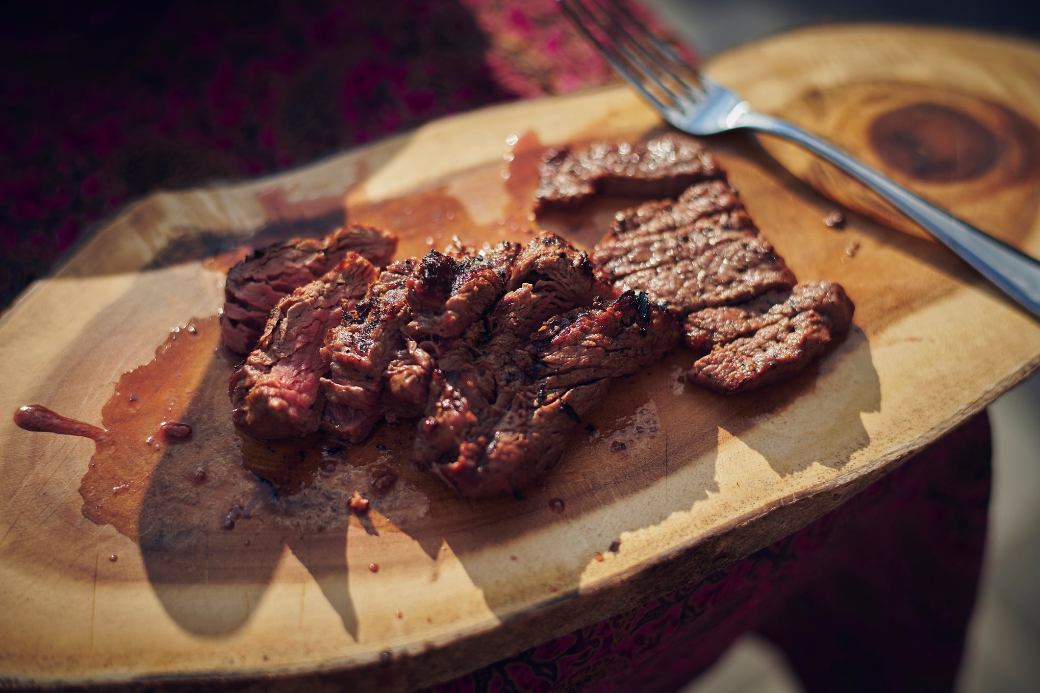 Close up of grilled tender meat in juices