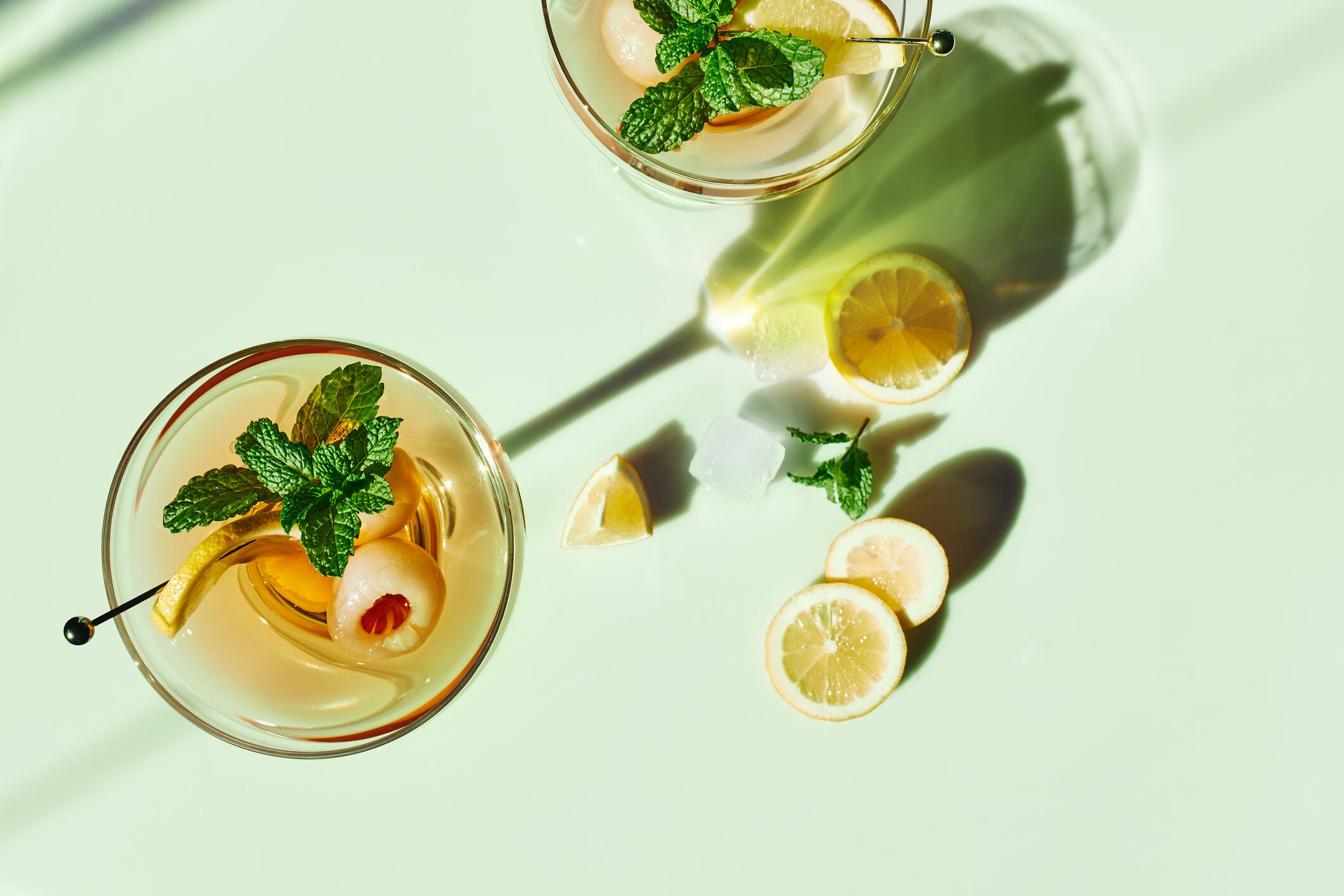 Refreshing lychee drink with lime, mint leaves and ice.