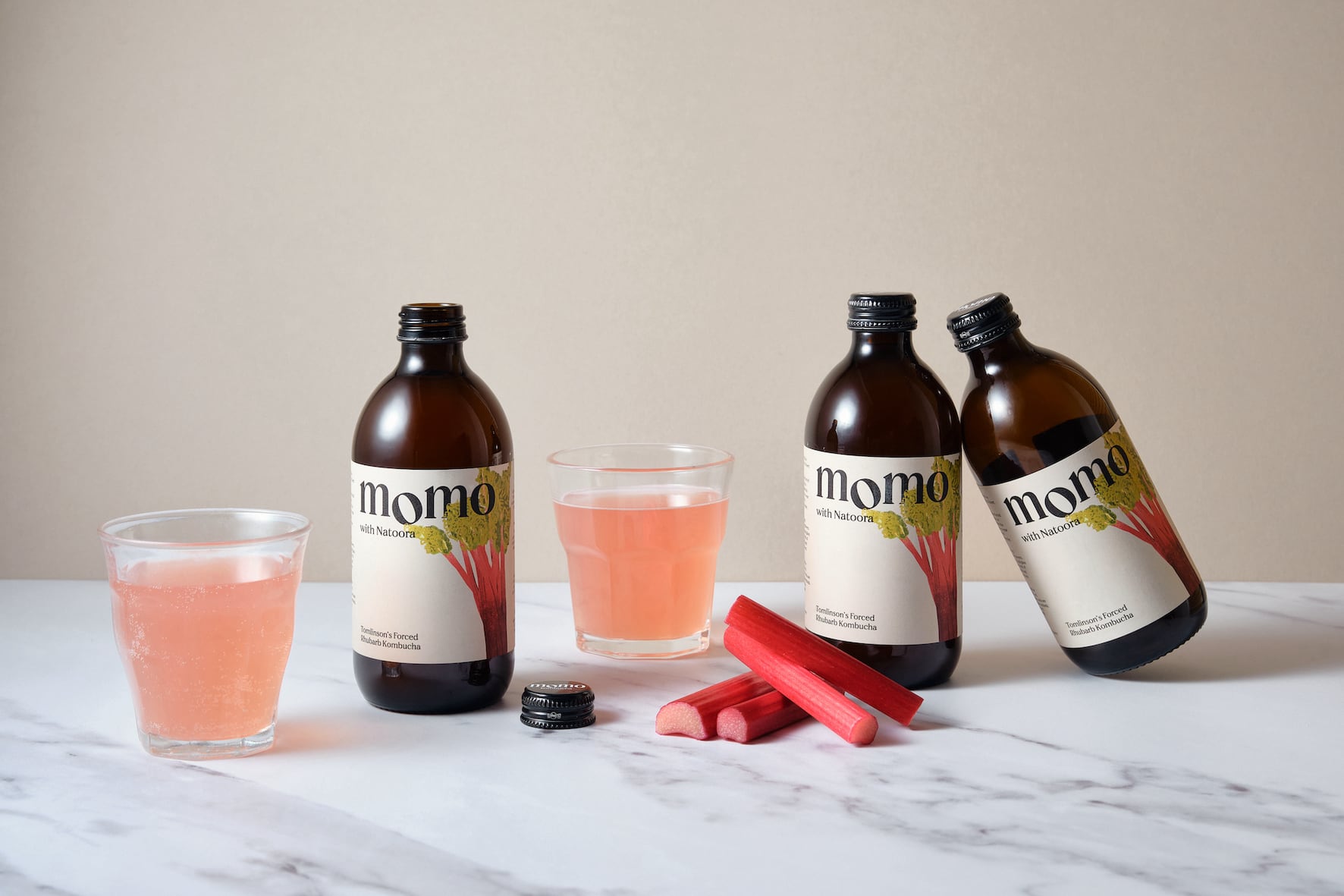 Bottle of MOMO seasonal kombucha produced with limited‑edition ingredients.