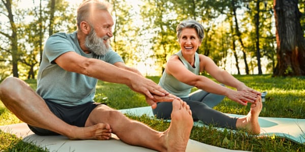 Two people stretching