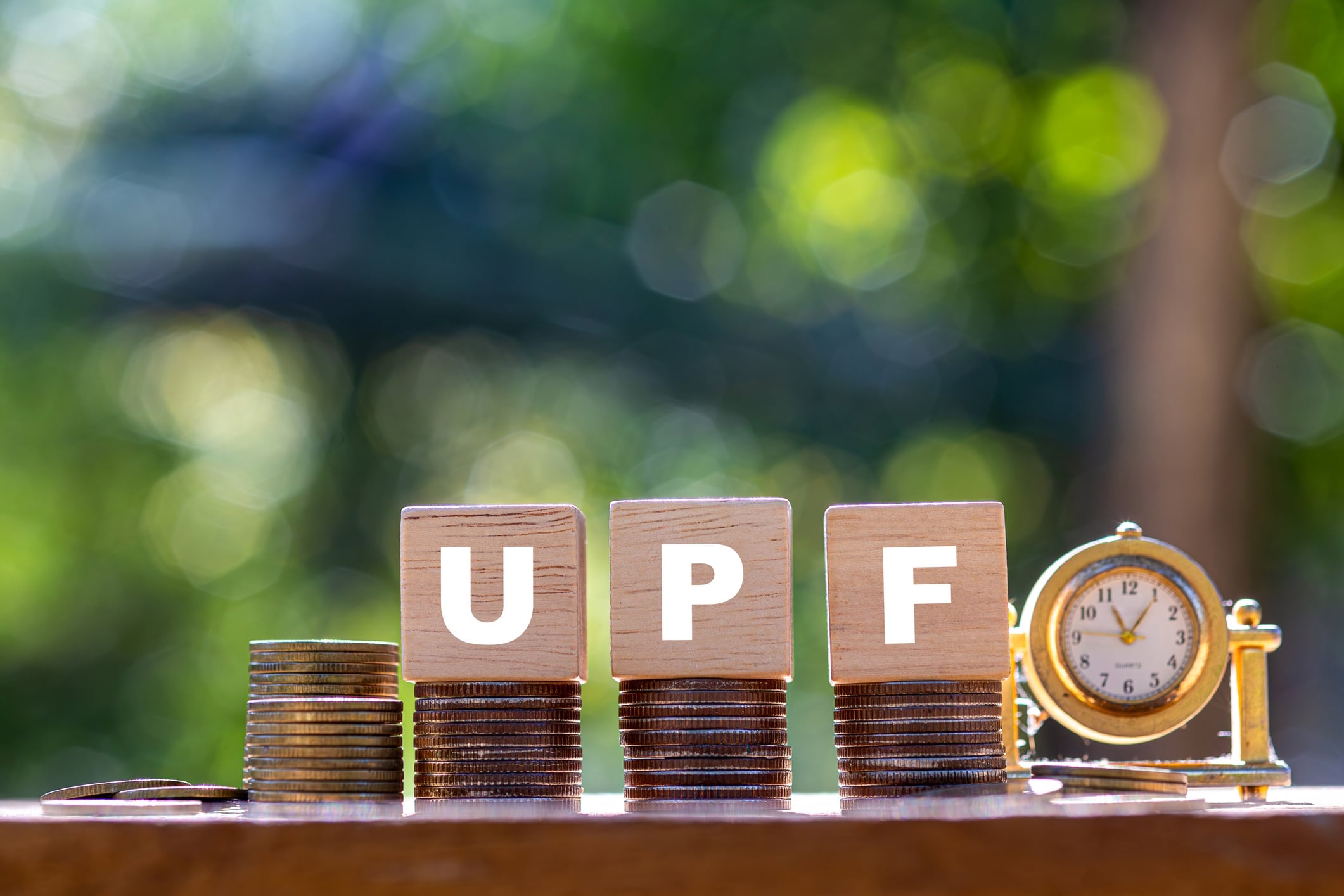 UPF regulation, money and clock Worawith Ounpeng GettyImages