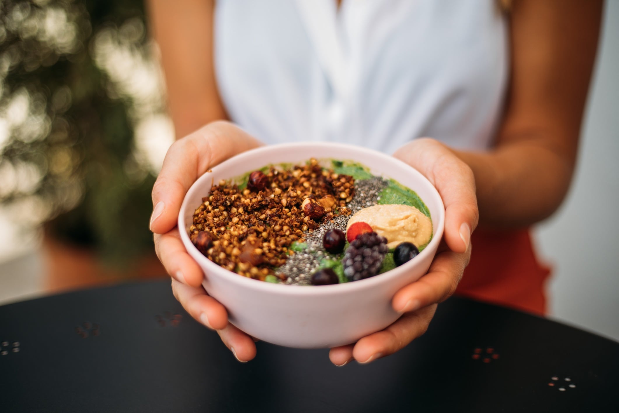 Woman eating smoothie bowl