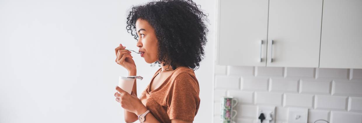 woman eating yogurt