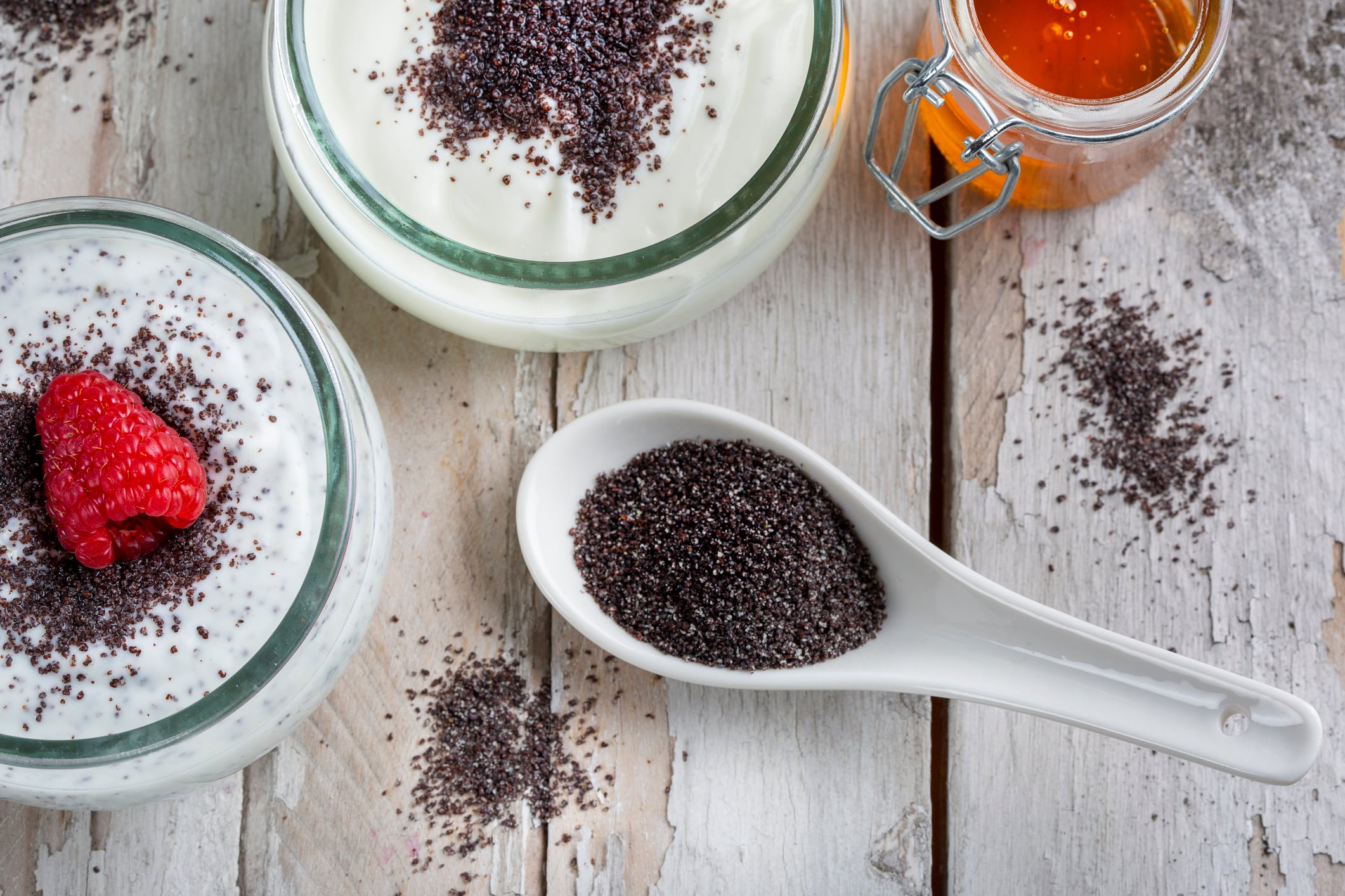 Poppy seed yoghurt dessert with honey and raspberries