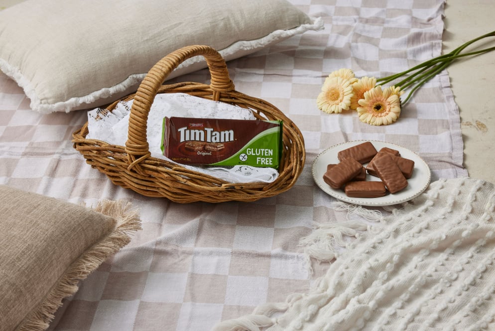 Tim Tam Original Gluten Free biscuit pack on shelf.