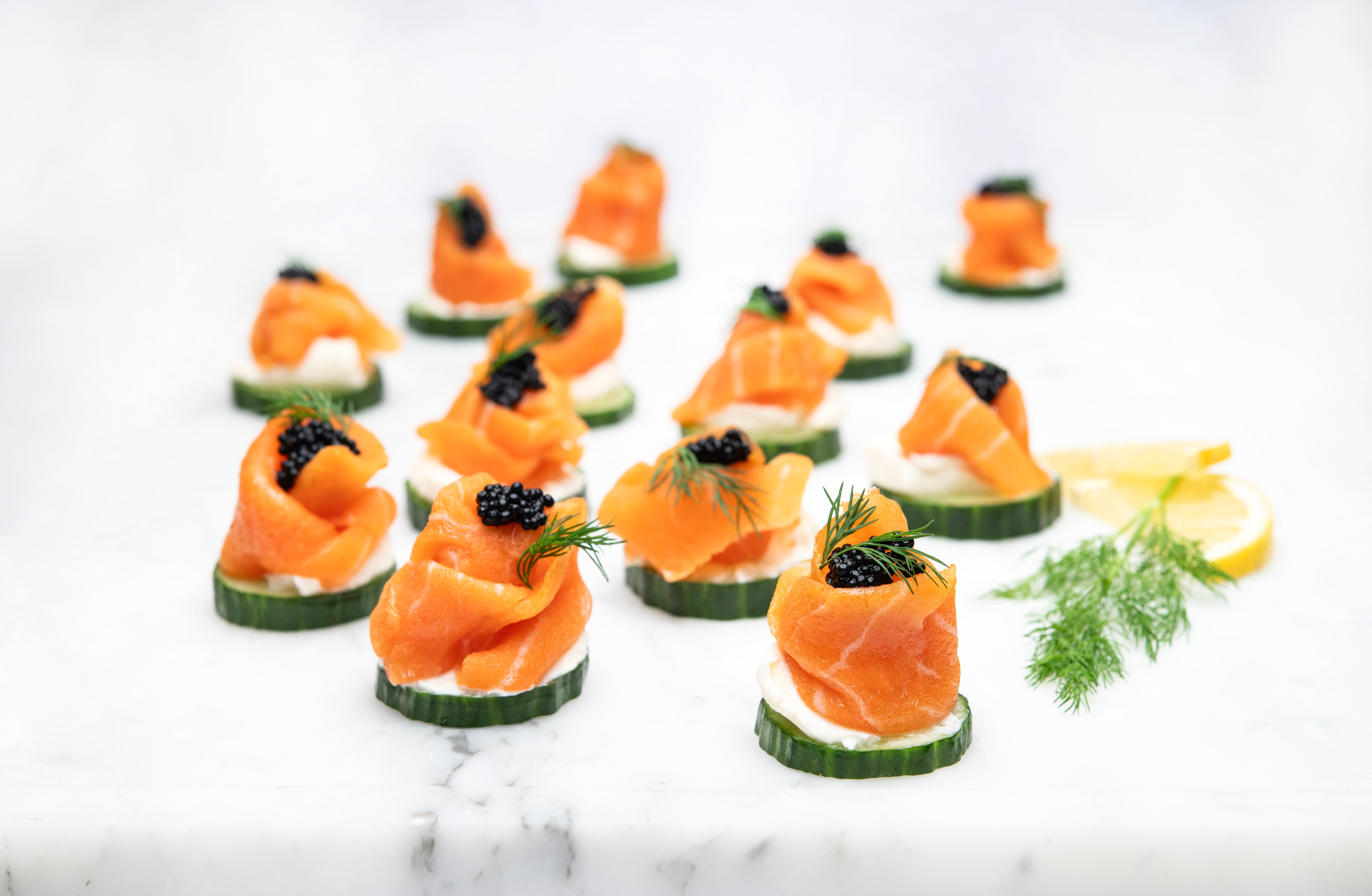 Konscious Foods' plant-based salmon placed on top of sliced cucumbers