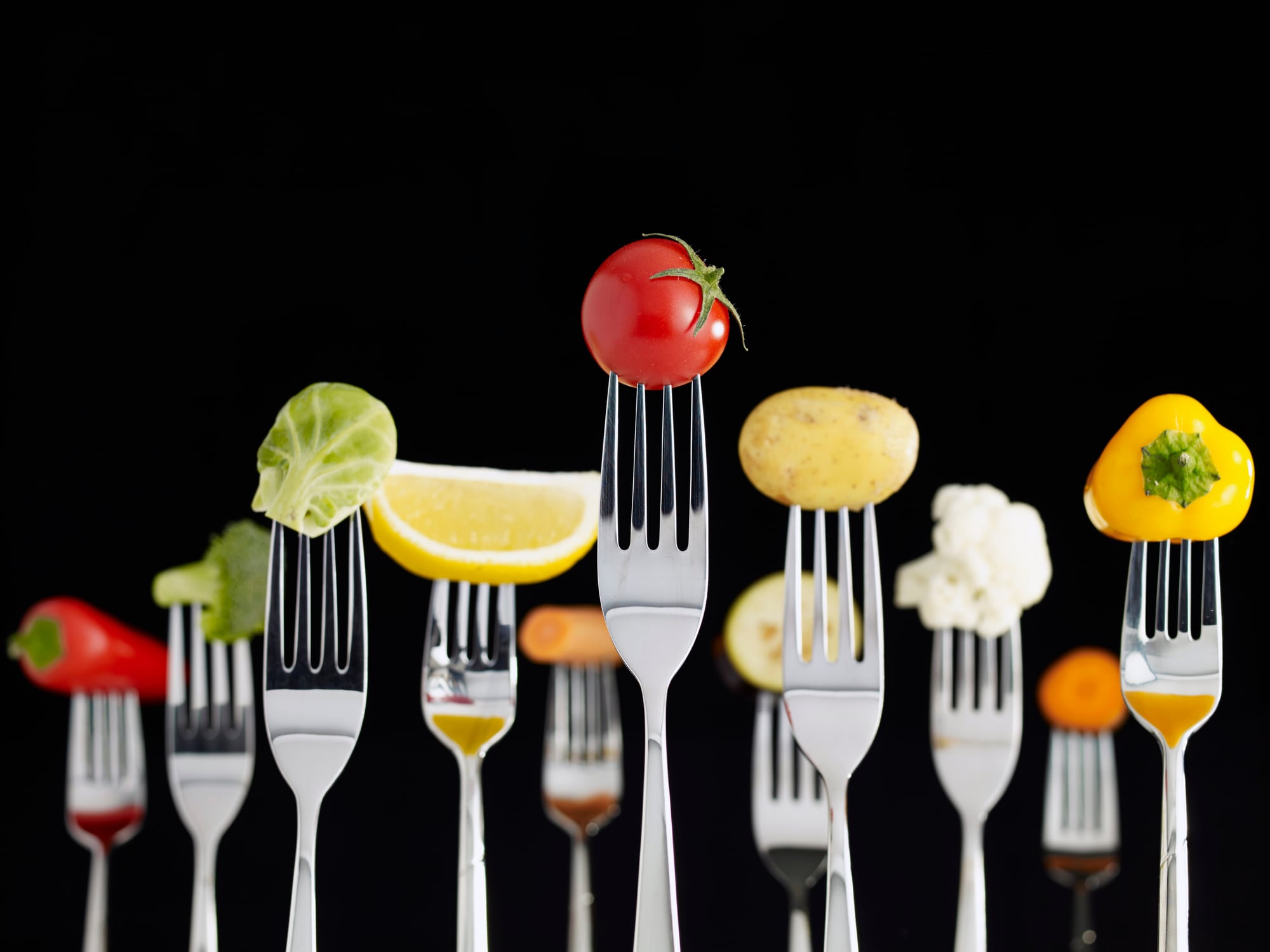 Fresh vegetables on forks