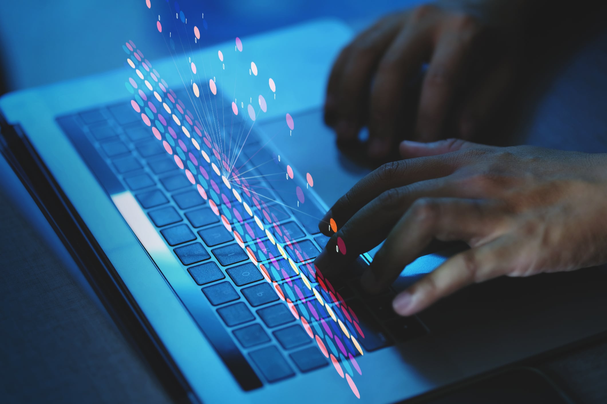 Person typing on laptop keyboard
