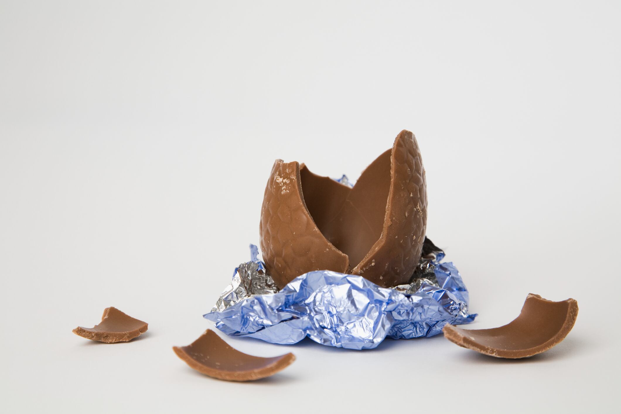 Broken Easter egg on white background