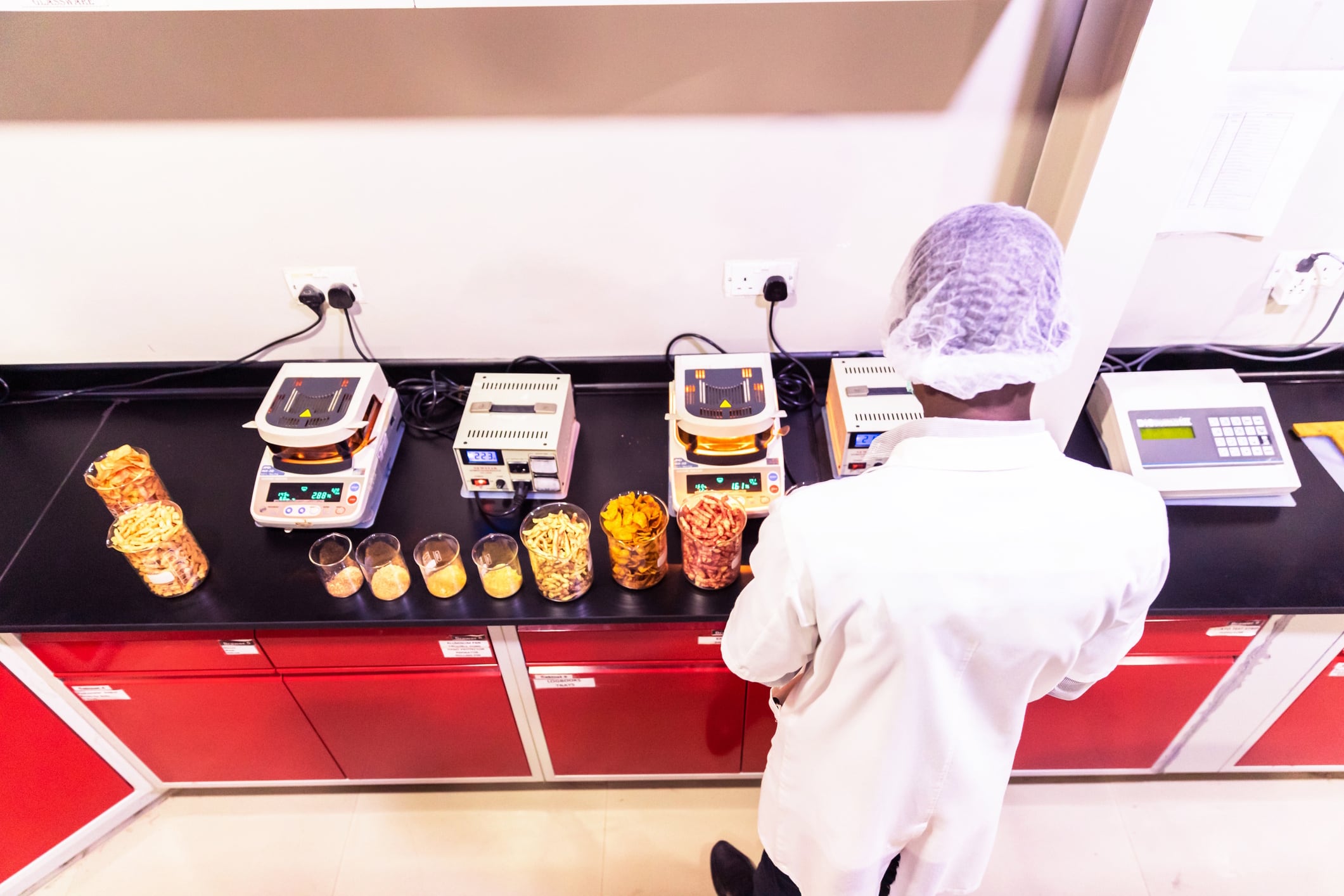 Lab technician testing snacks GCShutter GettyImages
