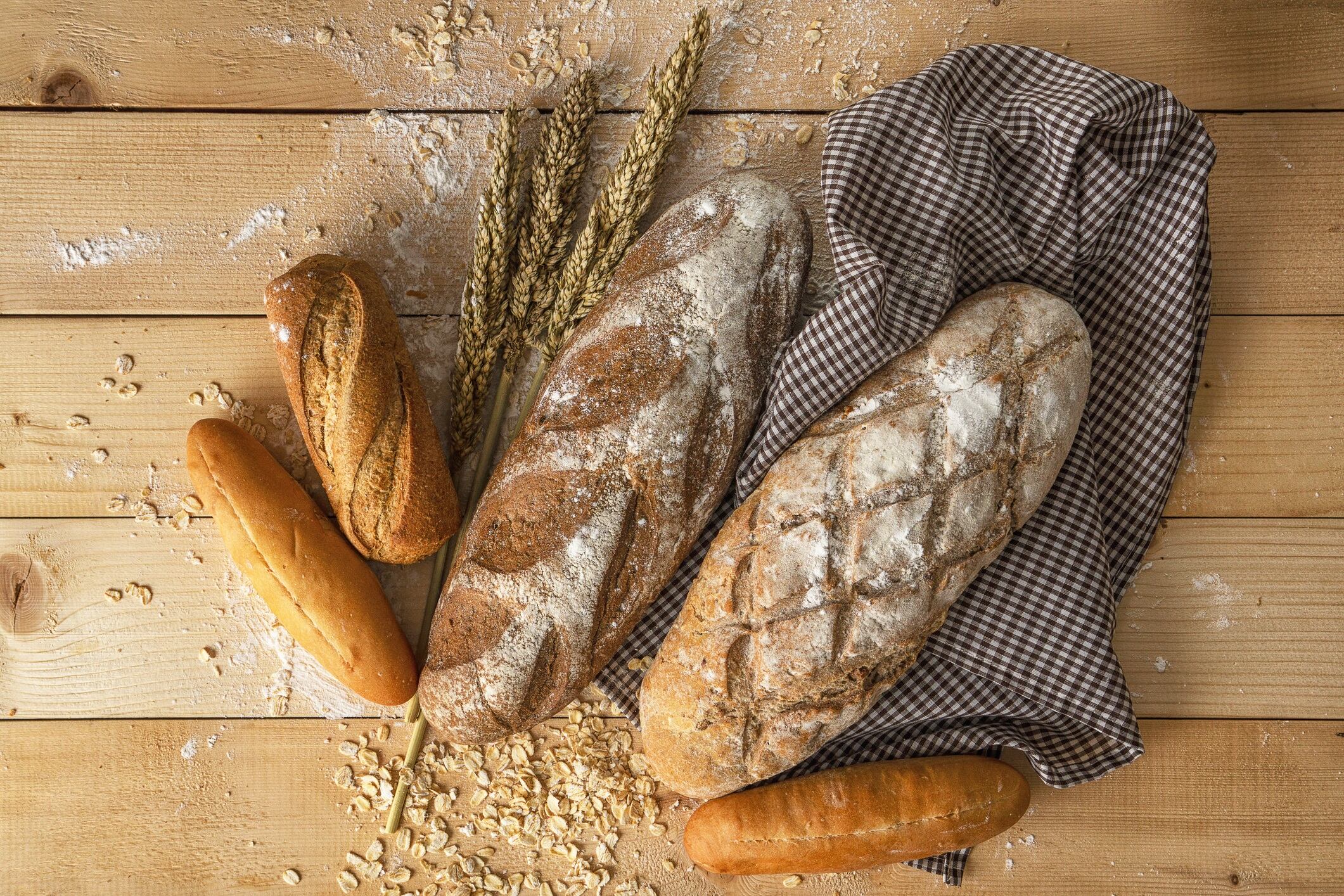 Variety kinds of bread on wooden table