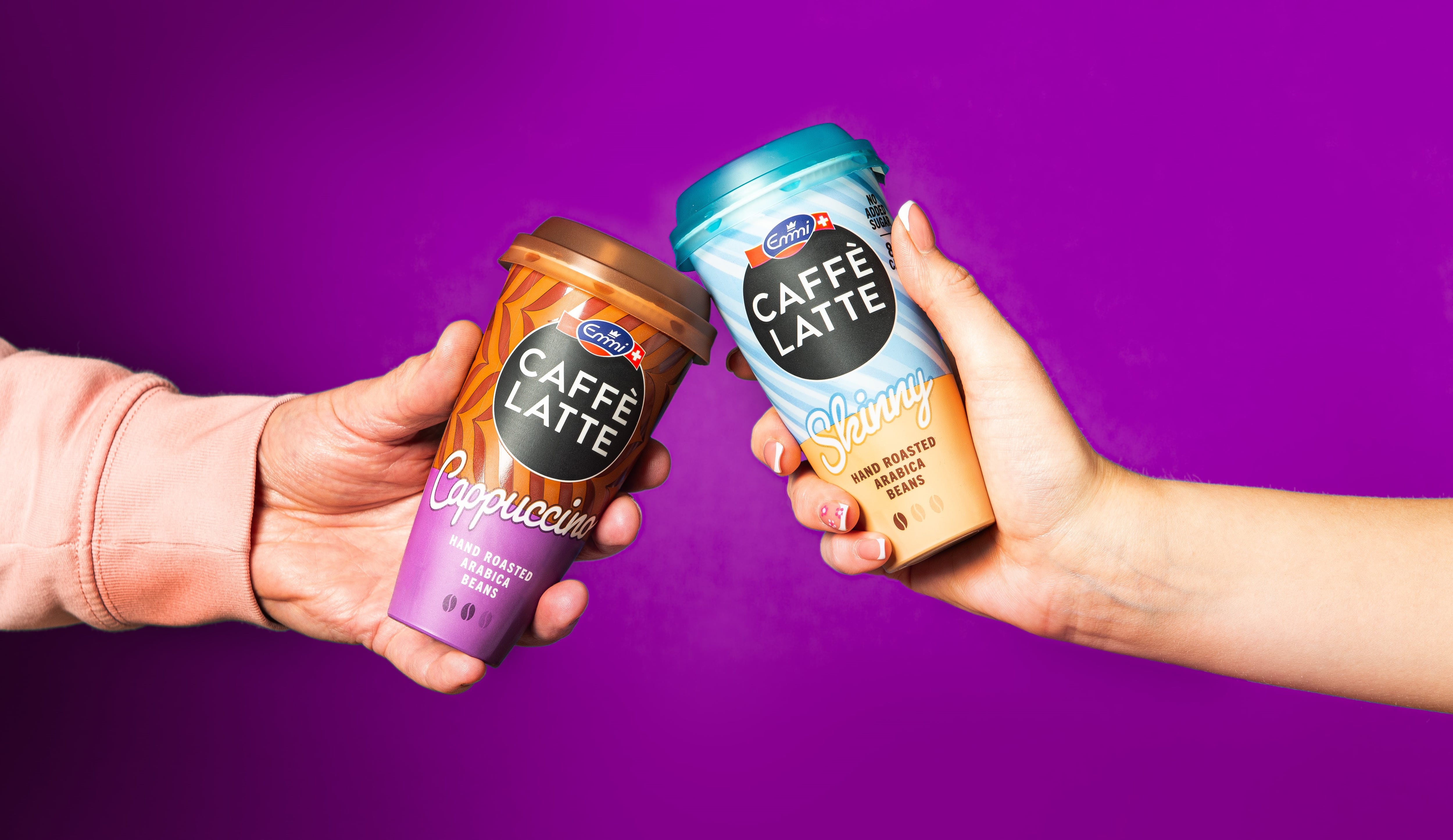 people holding iced coffee cups