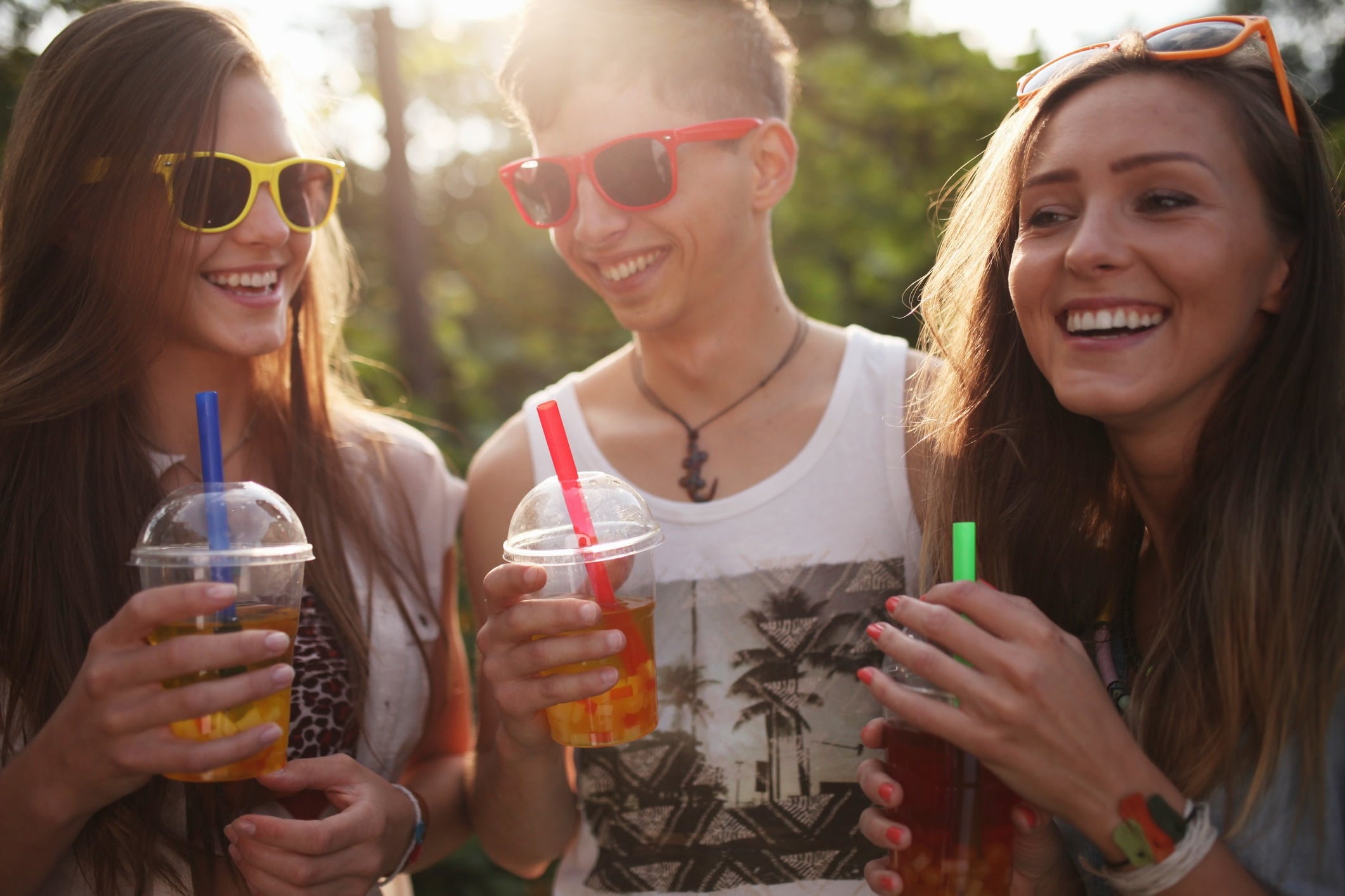 Young people enjoying drinks on a summer evening.