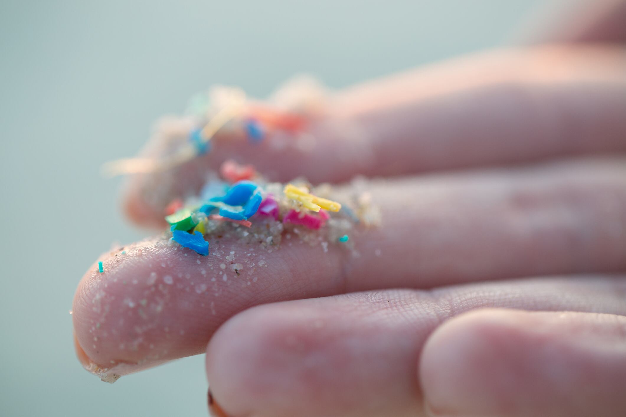 Hand with microplastics