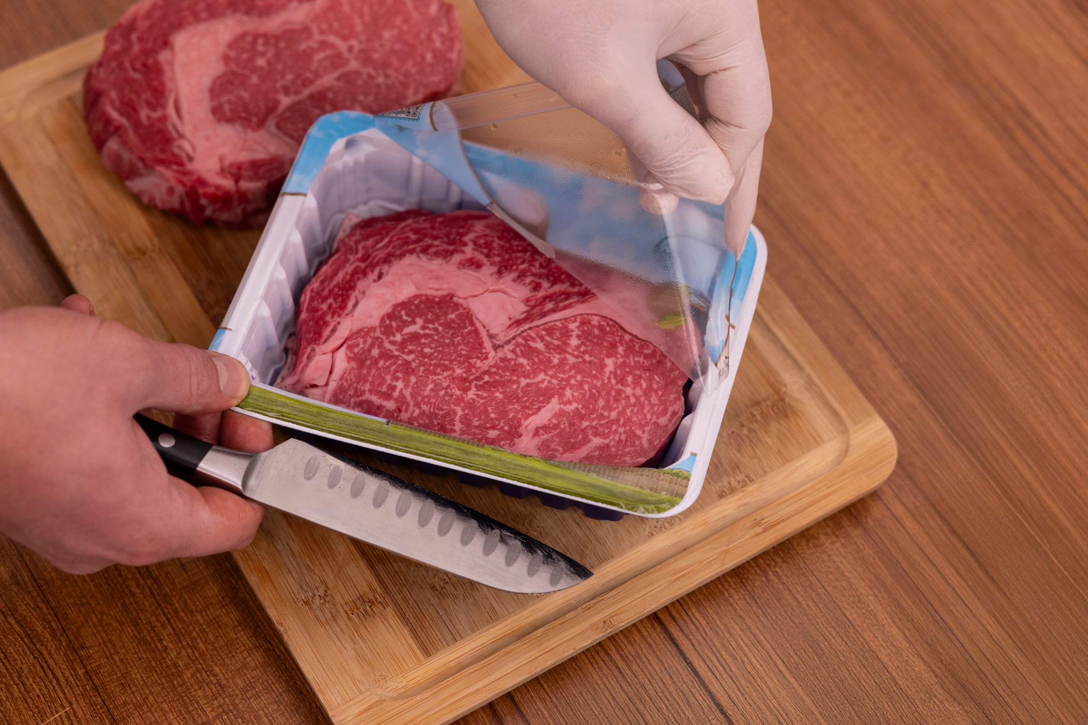 The beef is being unpacked from the package.