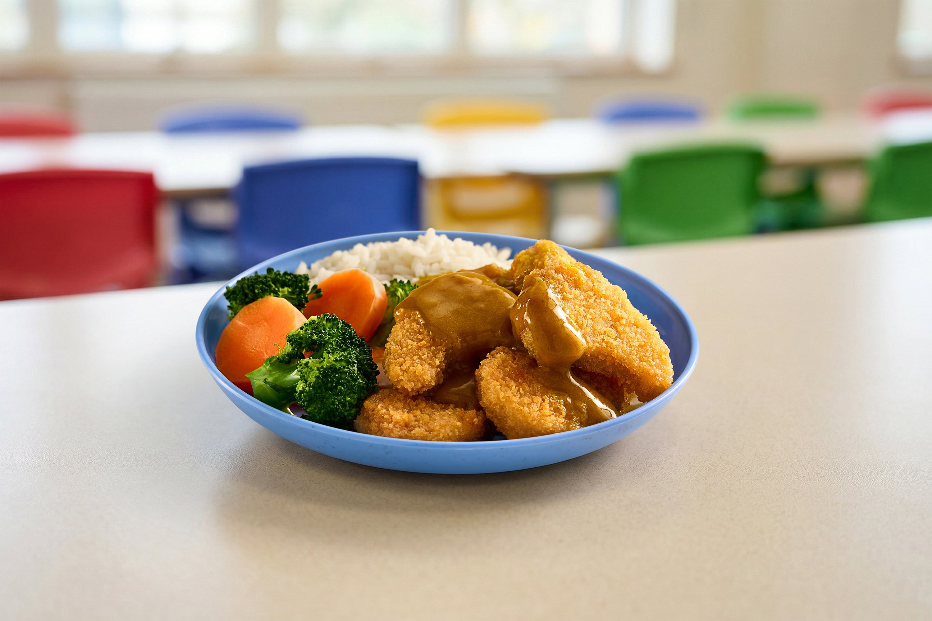 Box of Linda McCartney vegan Chicken Style Dippers served with dip.