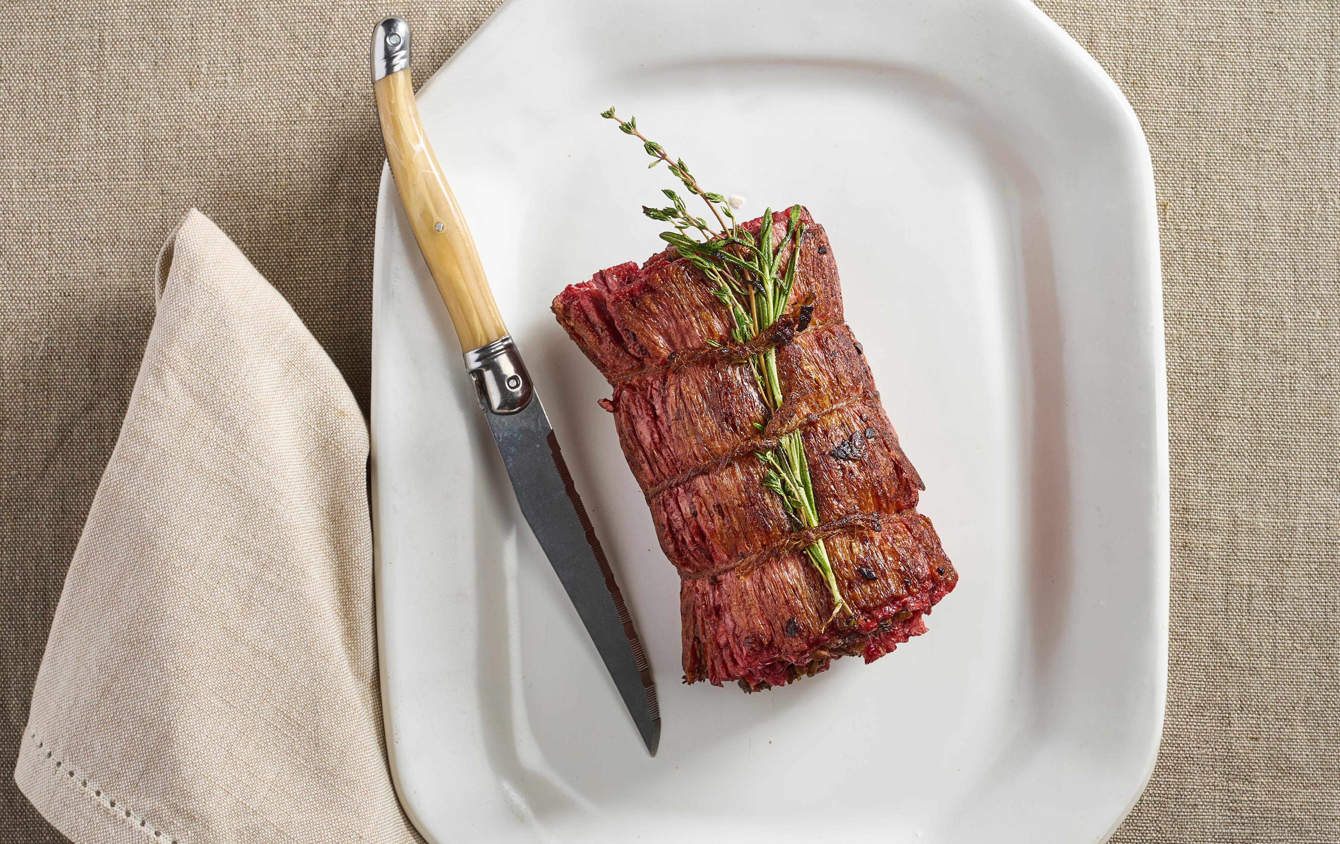 Redefine Meat plant-based flank steak served as a centre-of-plate dish.