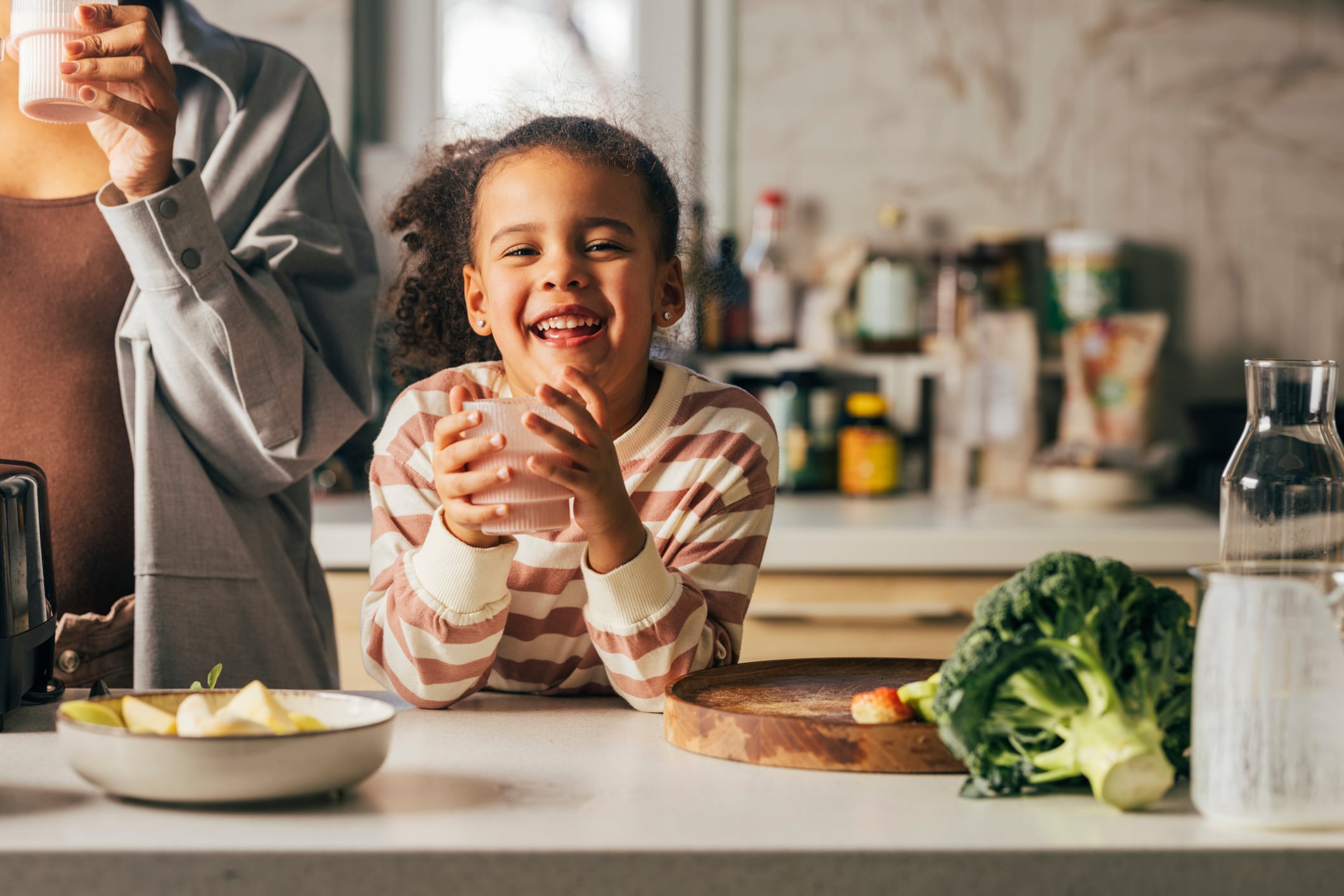 Educating consumers on the benefits of vegan and plant-based is essential. Image: An anonymous mother and her cute little daughter drinking their favorite juice made of raw healthy ingredients.