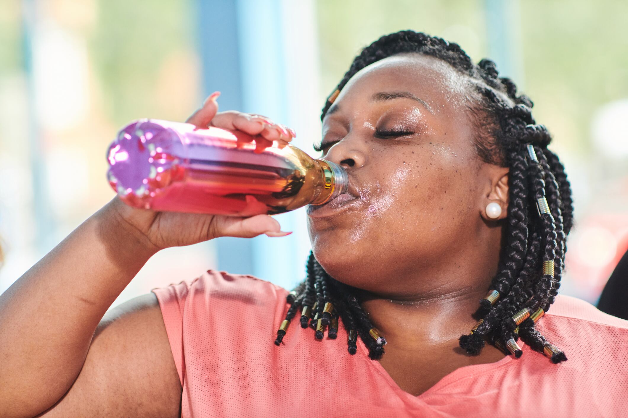 Portrait of a woman hot and sweaty after doing an indoor exercise class at a sports centre